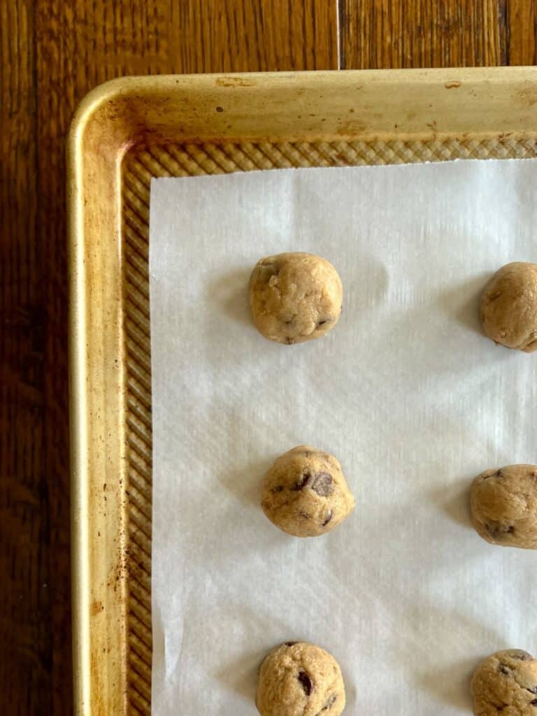 corner of baking sheet holding banana bread cookie dough freezer bites