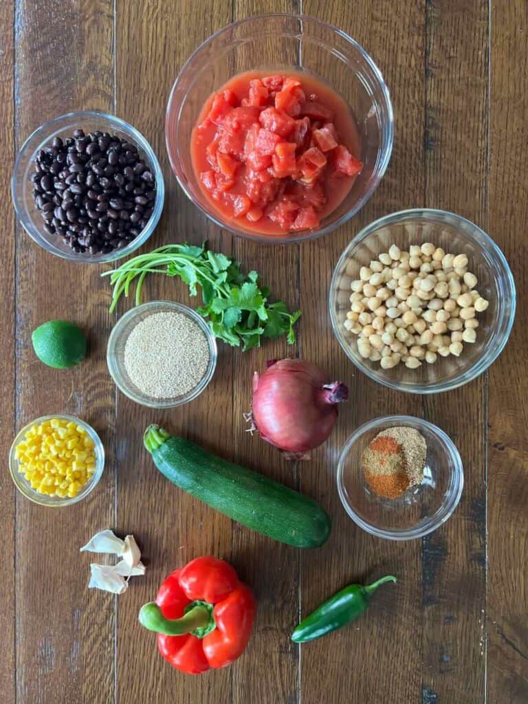 overhead photo of ingredients in glass bowls on a wood table