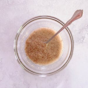 flax egg in glass bowl with a spoon