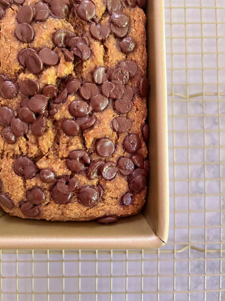 close up of baked oil-free perfect banana bread cooling on rack