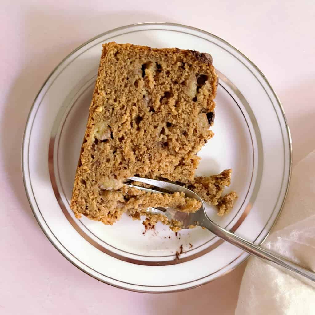 slice of perfect oil-free banana bread with a fork on a plate