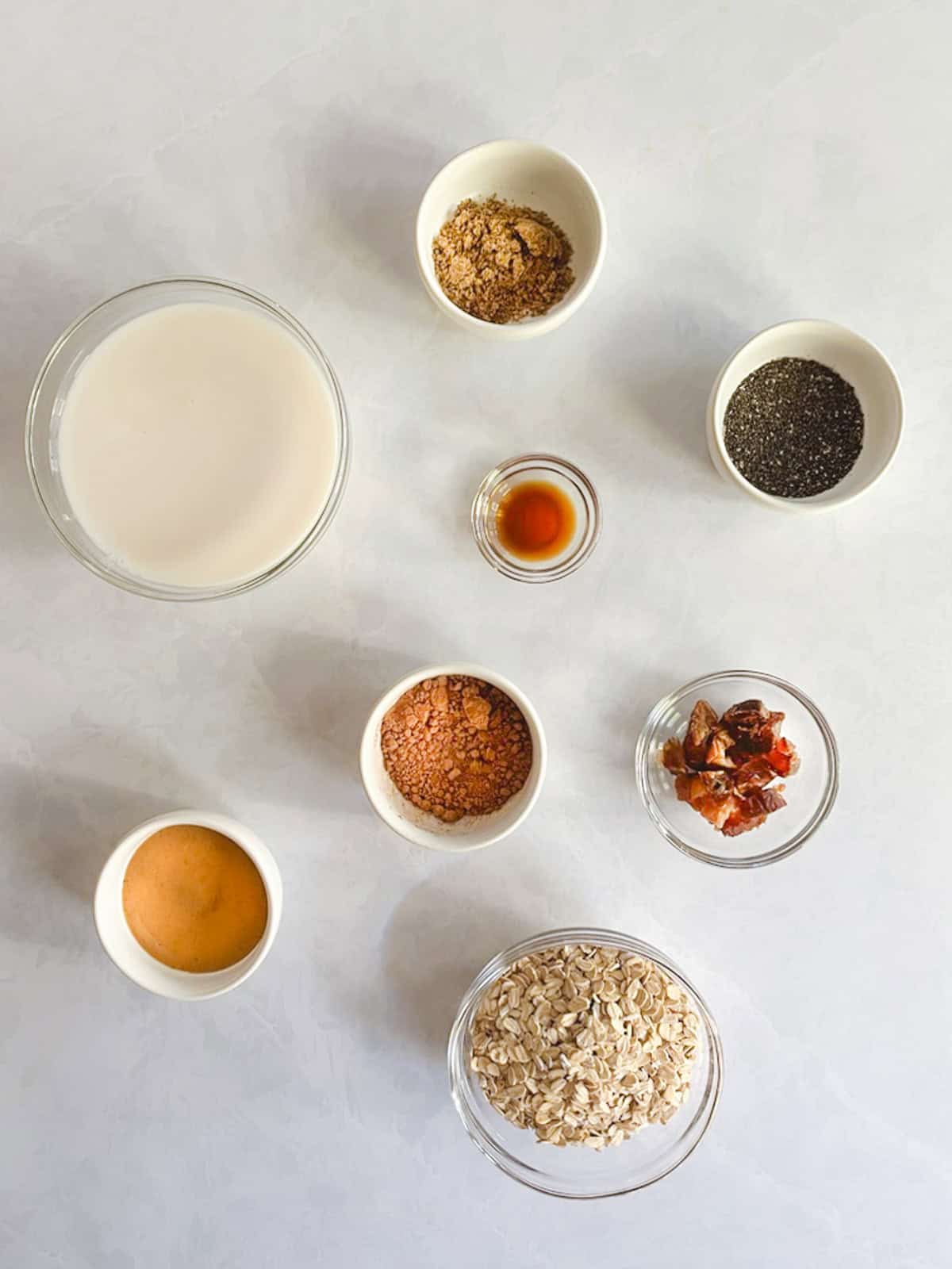 overhead view of ingredients for creamy blended chocolate peanut butter overnight oats