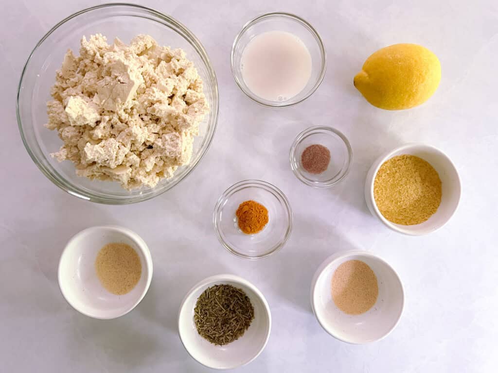 overhead view of bowls containing ingredients for herbed tofu scramble