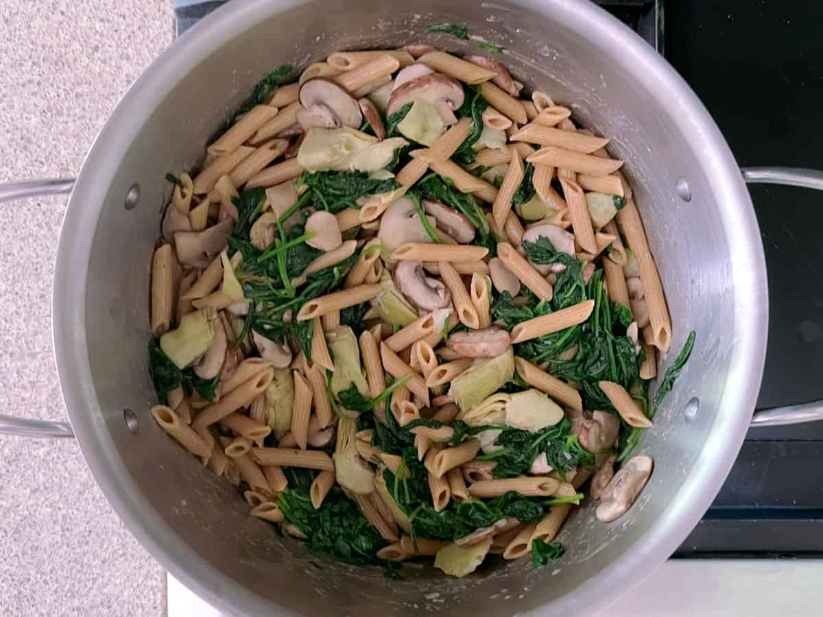 pot of spinach, mushroom, and artichoke pasta