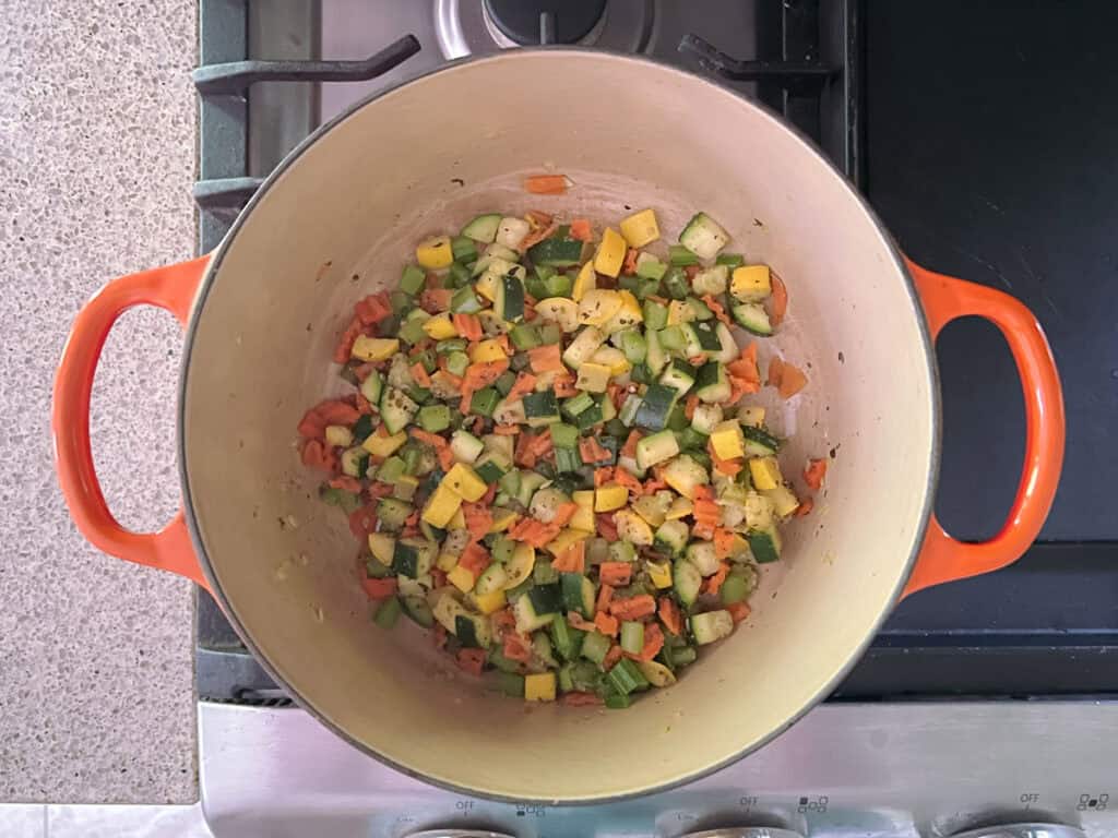 cooked and seasoned veggies in a dutch oven