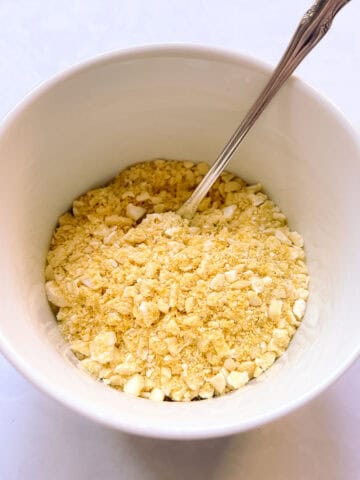 bowl of quick vegan Parmesan with a spoon