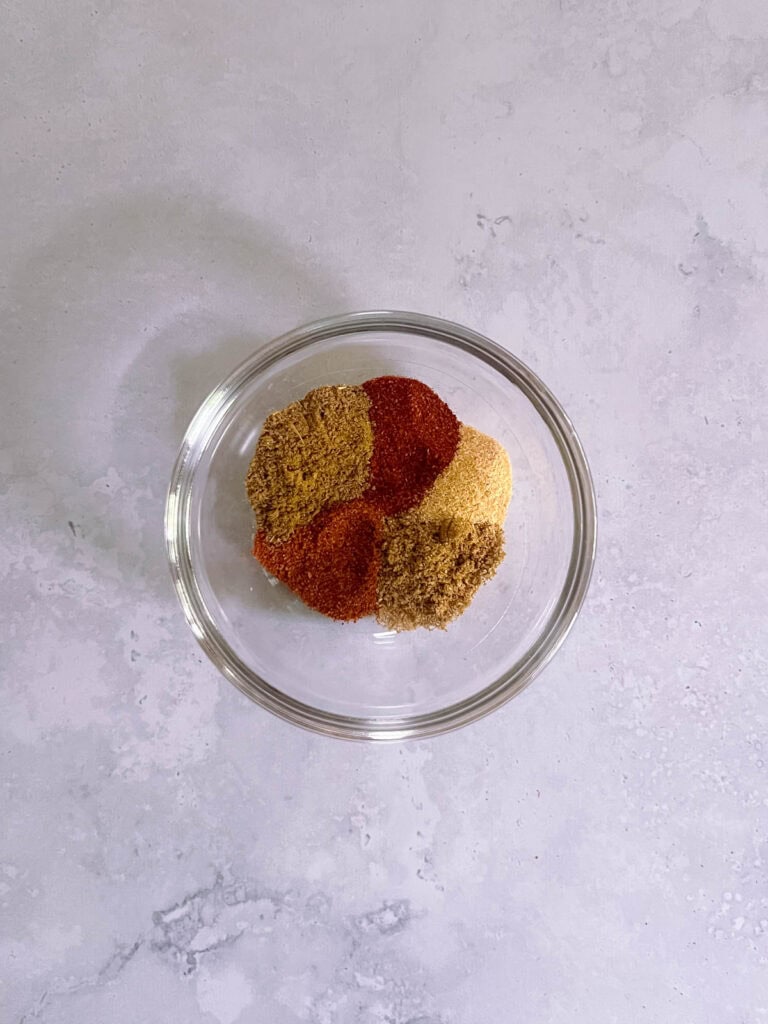 small bowl containing unmixed spices for Tex-Mex seasoning blend