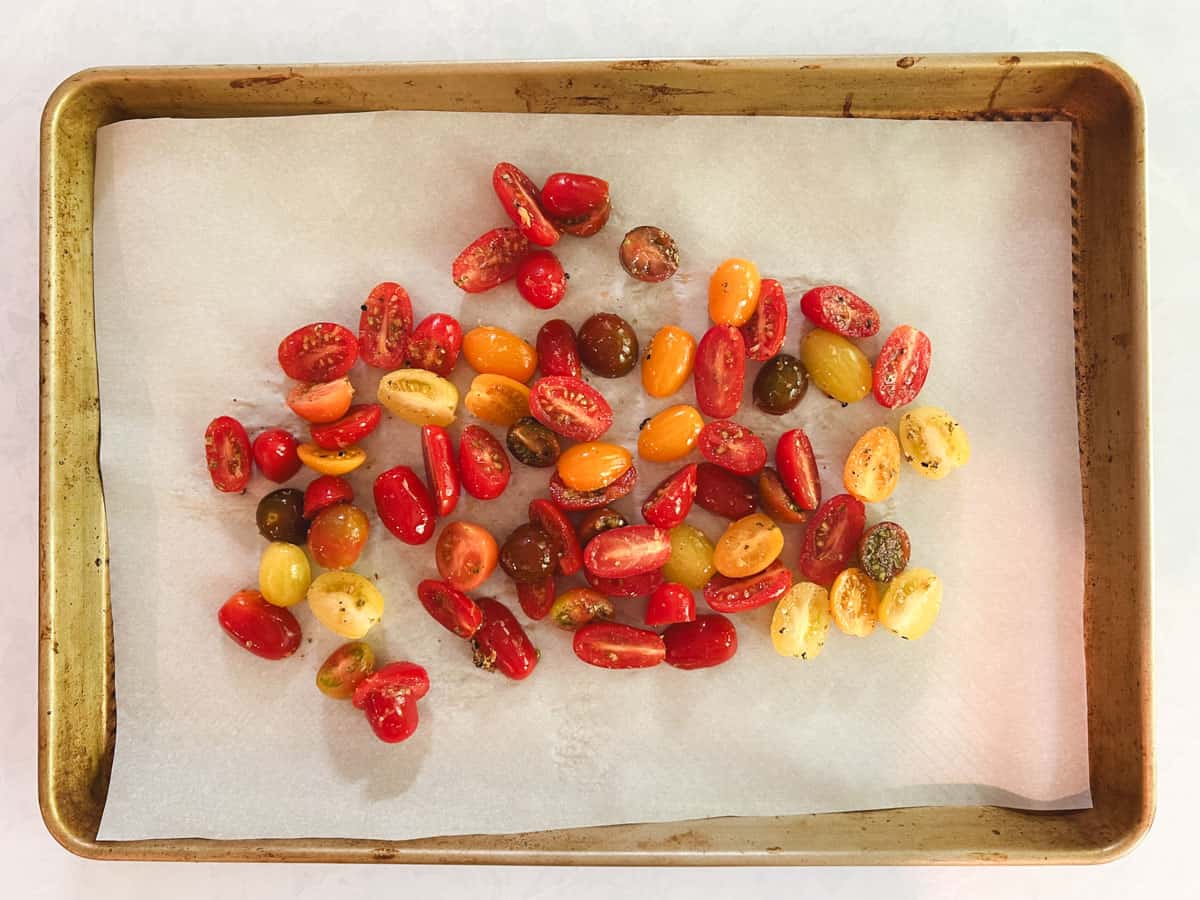 prepared baking sheet of halved grape tomatoes