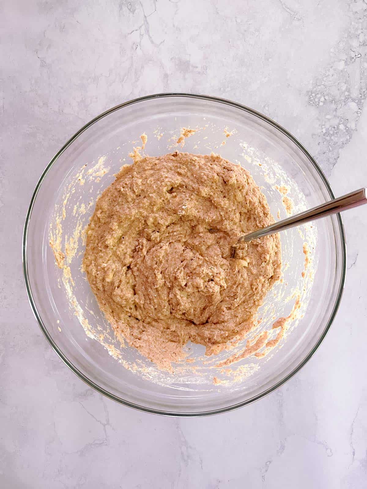 wet and dry ingredients and flax egg mixed in a bowl