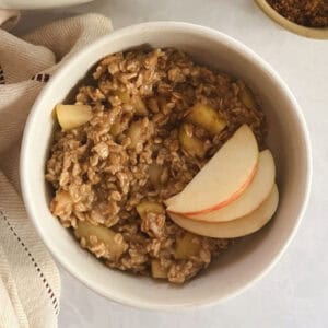 bowl of one-pot apple cinnamon oatmeal garnished with apple slices