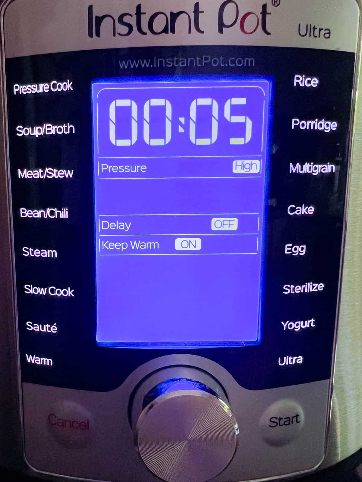 display panel of instant pot set to pressure cook on high for 5 minutes