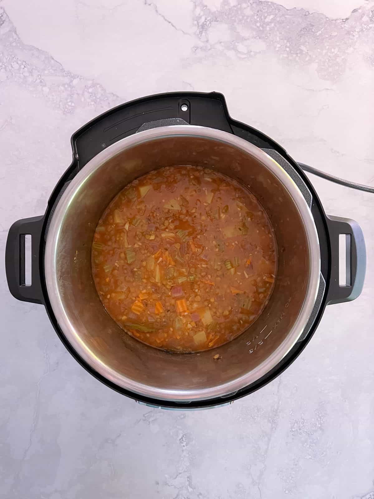 overhead of instant pot with lid removed and cooked lentil soup