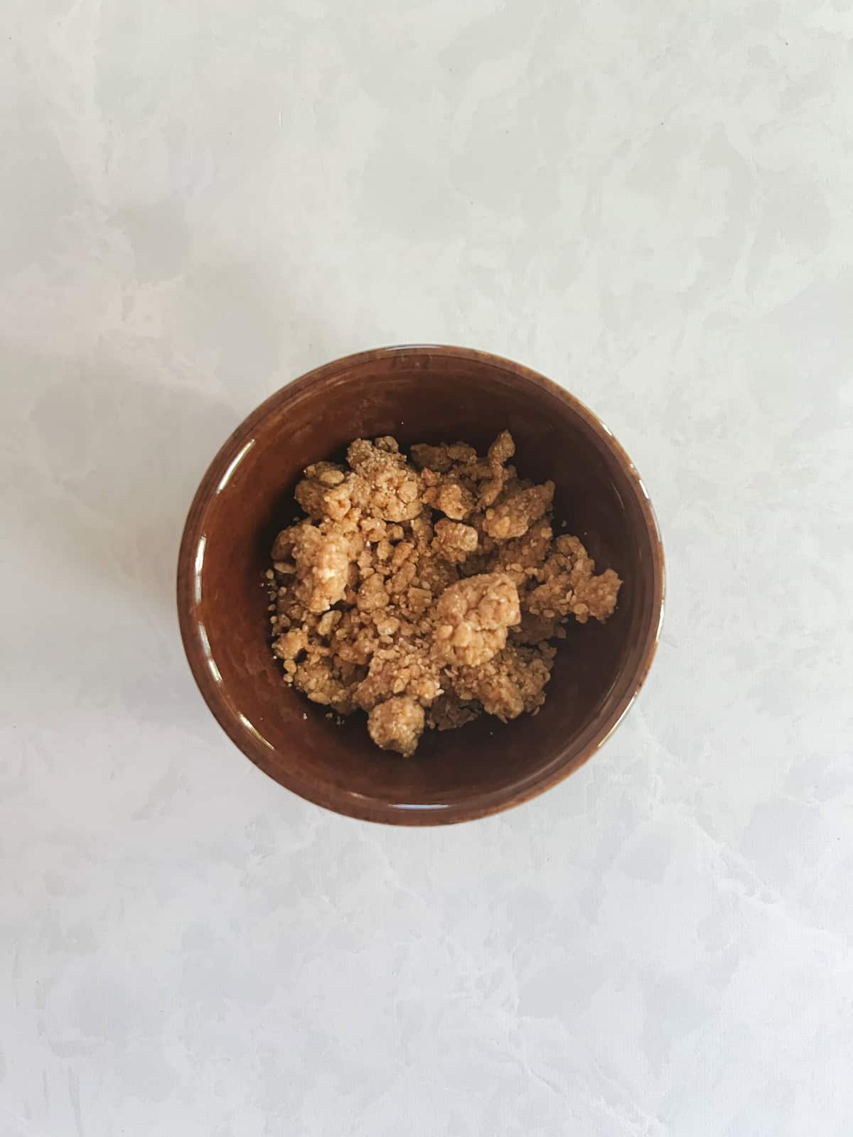 bowl of graham cookie crumble following refrigeration