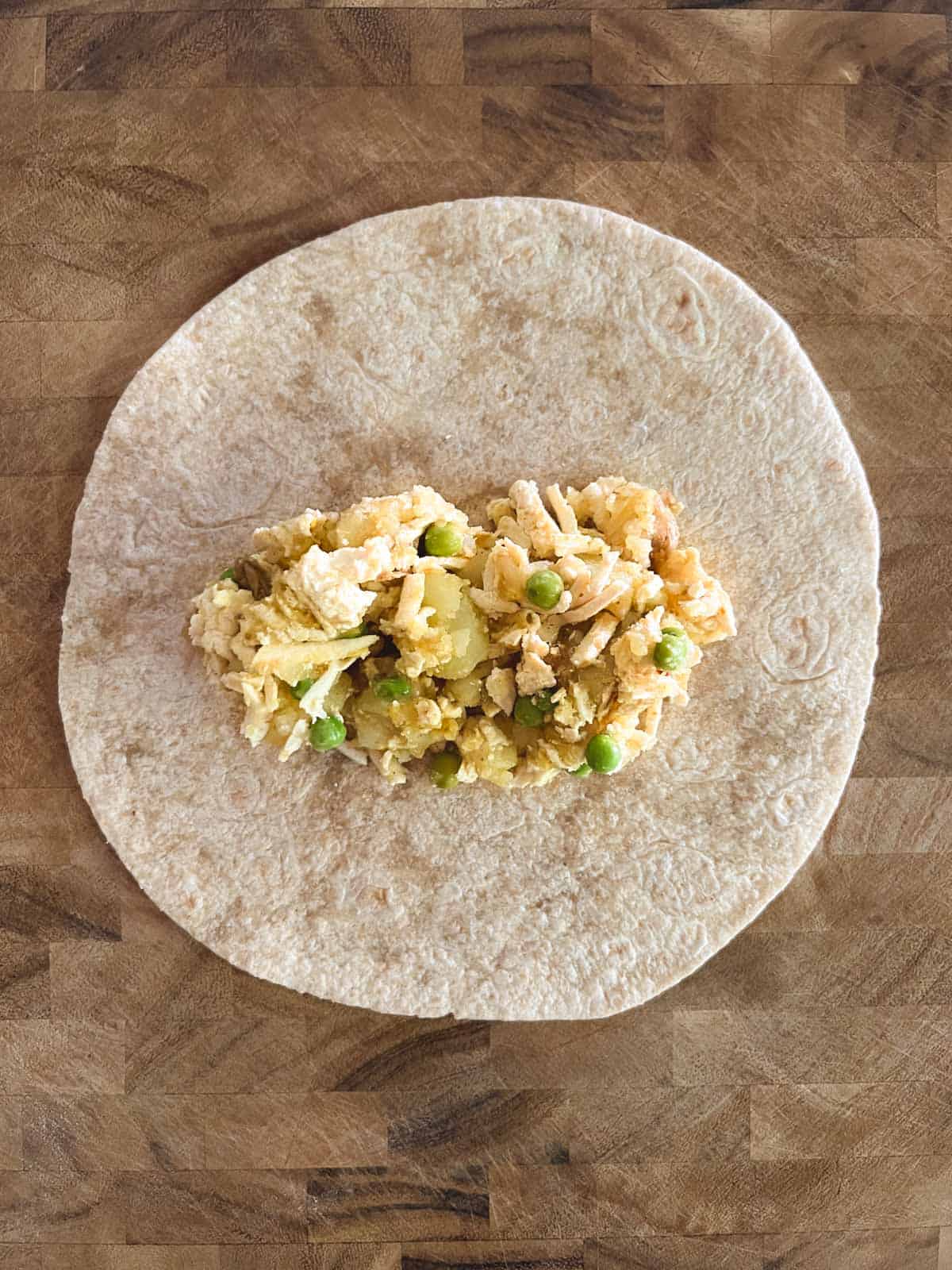 whole-wheat wrap with potato mixture on top in the center