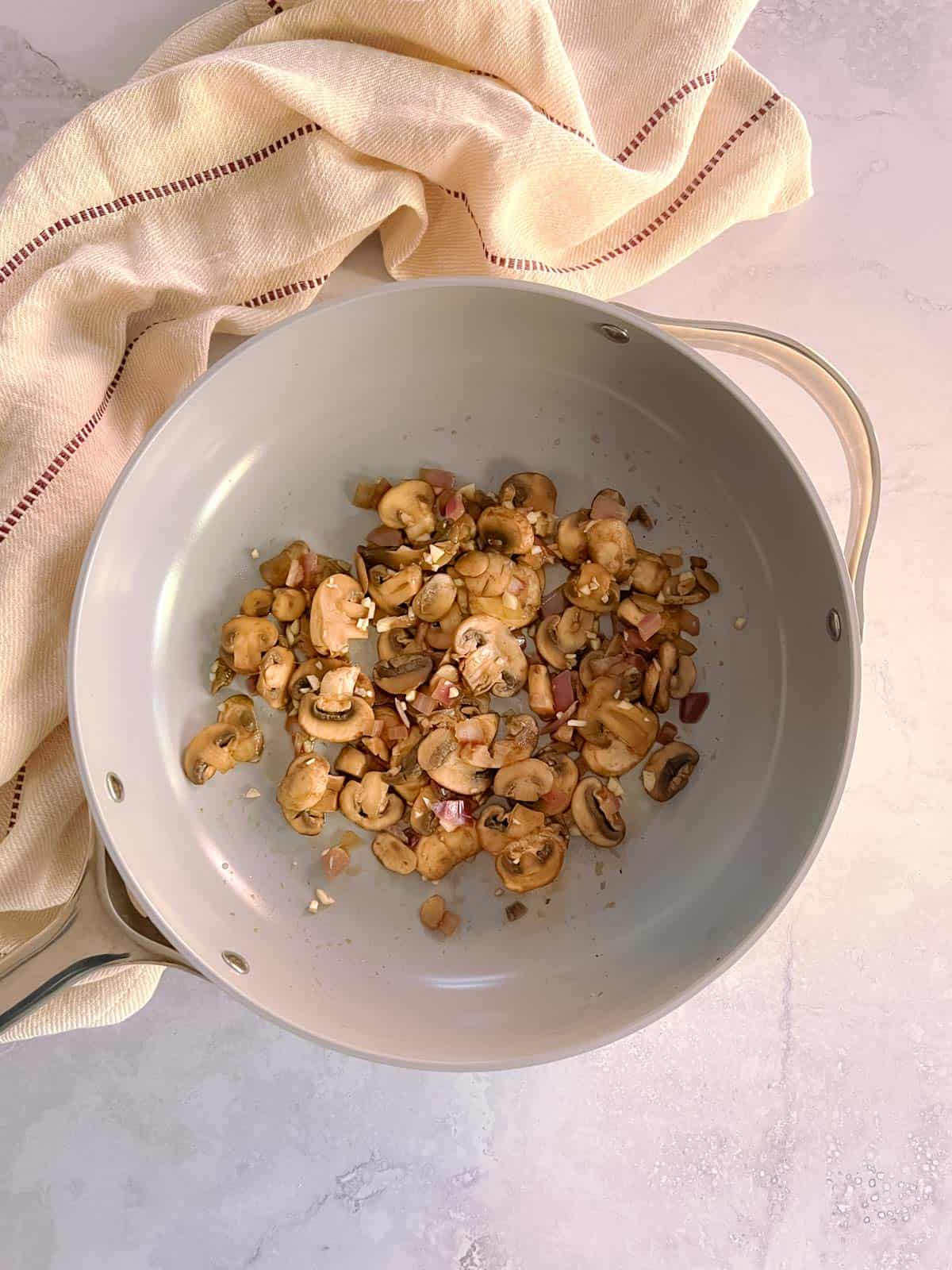 mushrooms, onions, and garlic cooked in a skillet