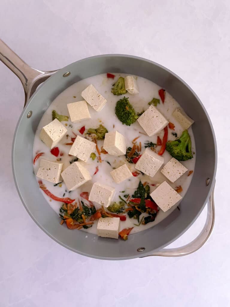 saute pan with coconut milk, tofu, and water added