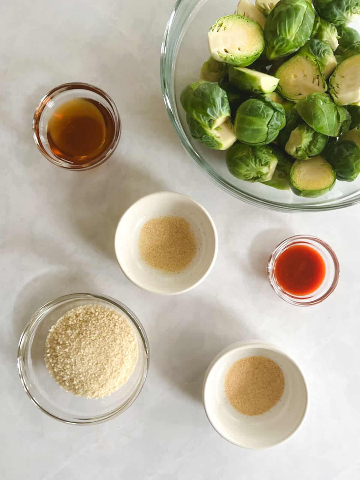 overhead view of ingredients for crispy brussels sprouts with spicy maple syrup