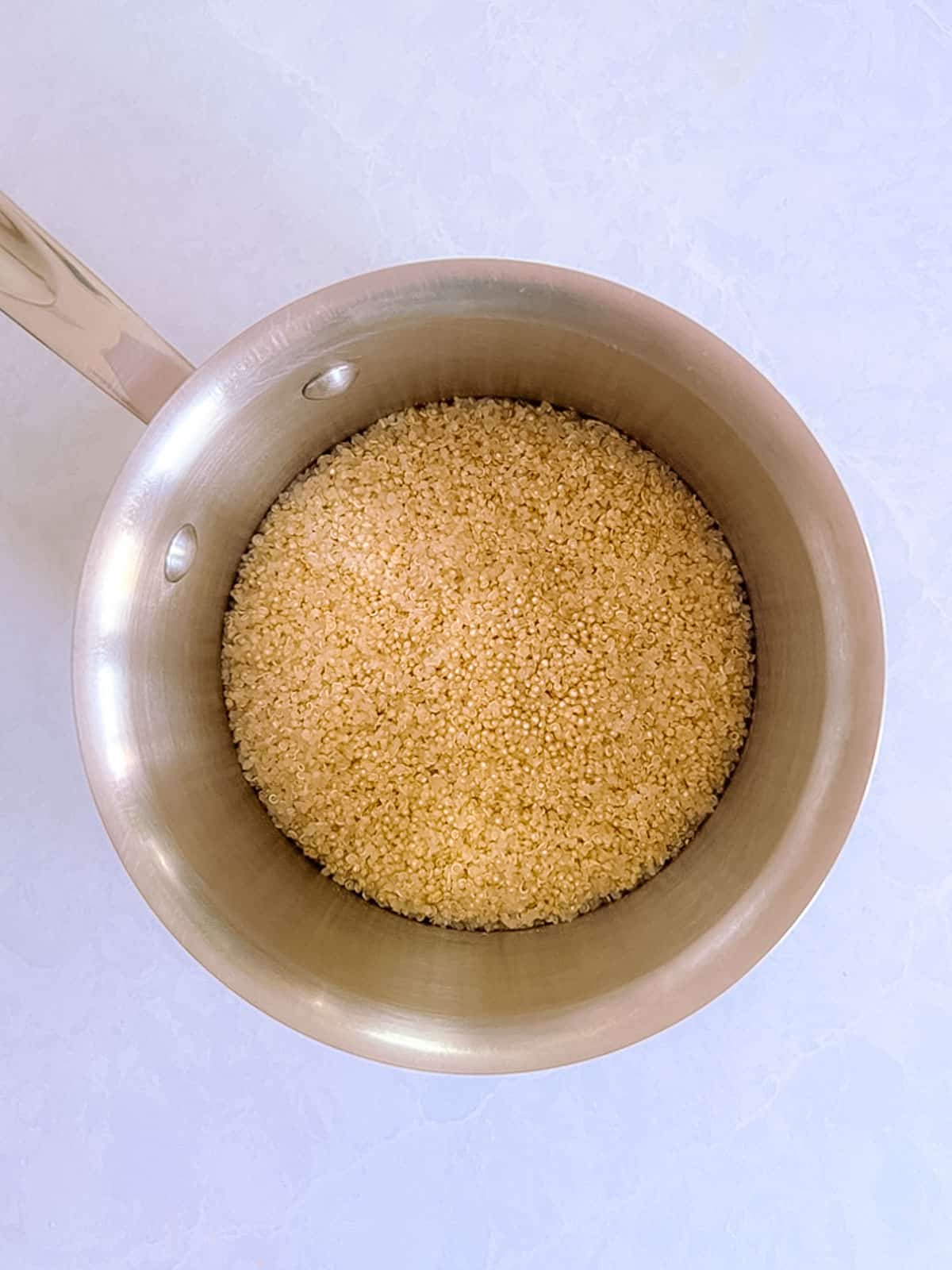 overhead view of small pot containing cooked quinoa