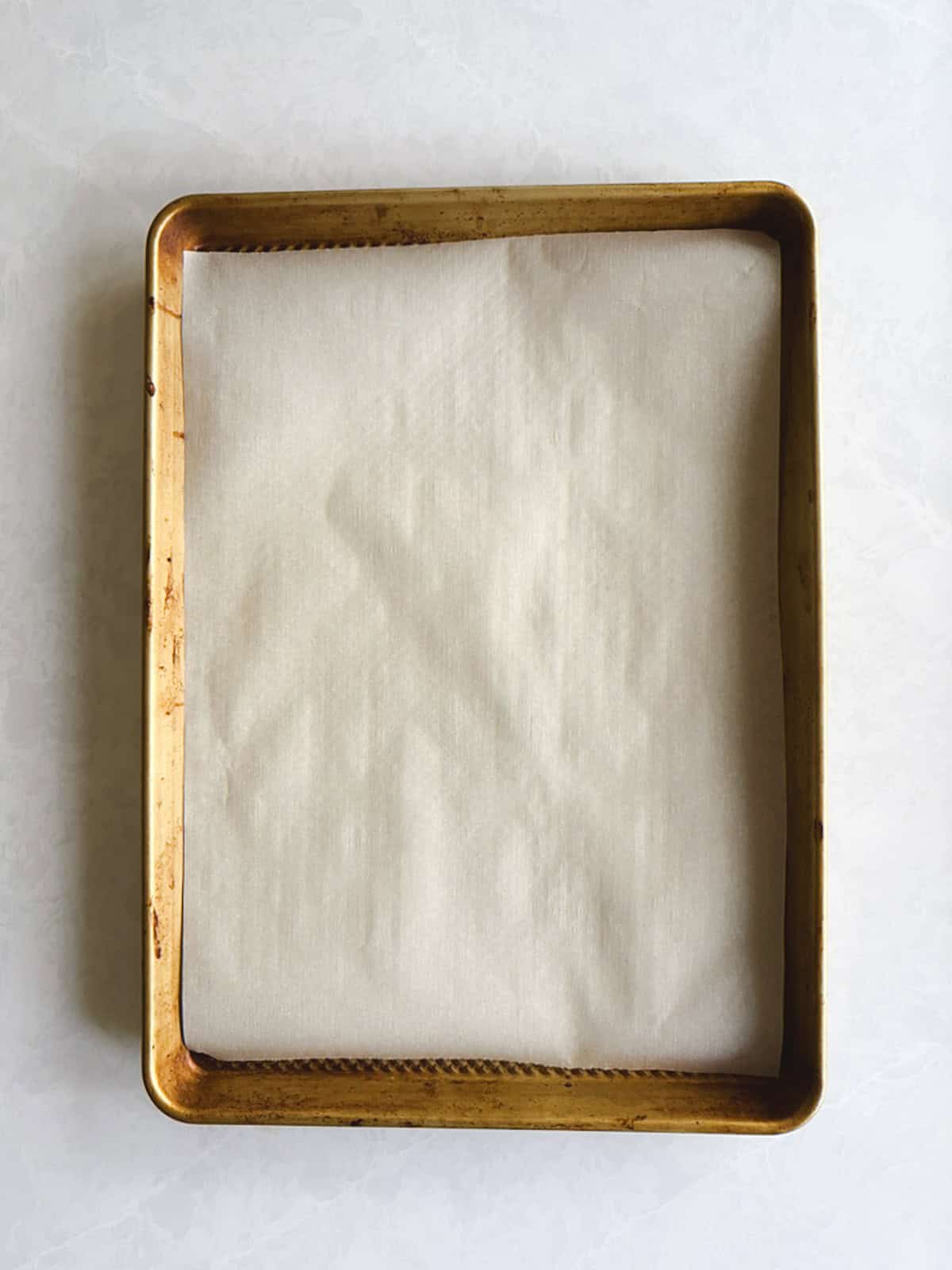 overhead view of baking sheet lined with parchment paper