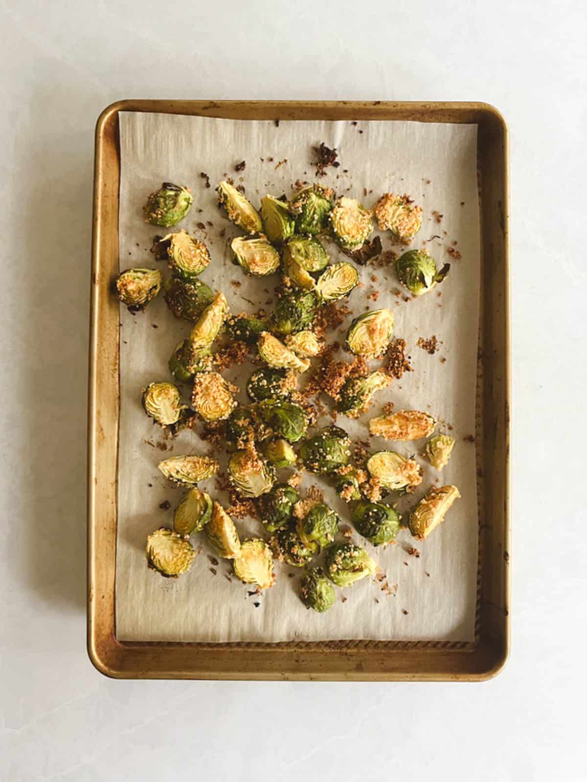 prepared baking sheet containing roasted crispy brussels sprouts