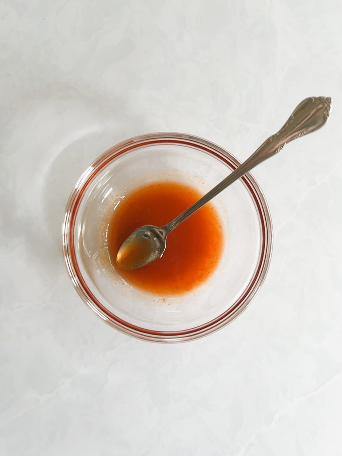 overhead of small bowl containing spicy maple syrup