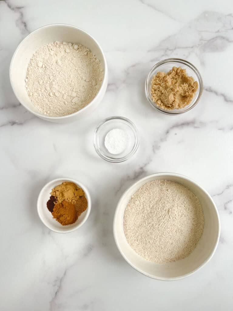 overhead view of glass bowls containing dry ingredients