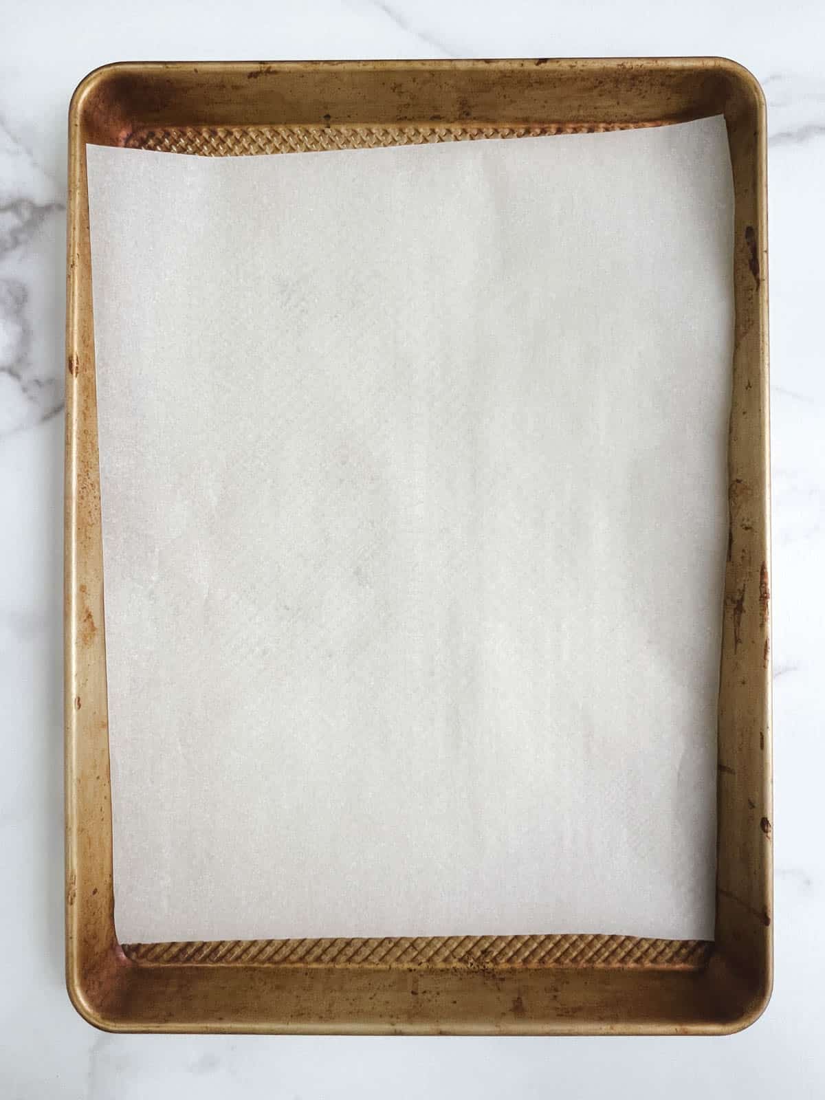 overhead view of baking sheet lined with parchment paper