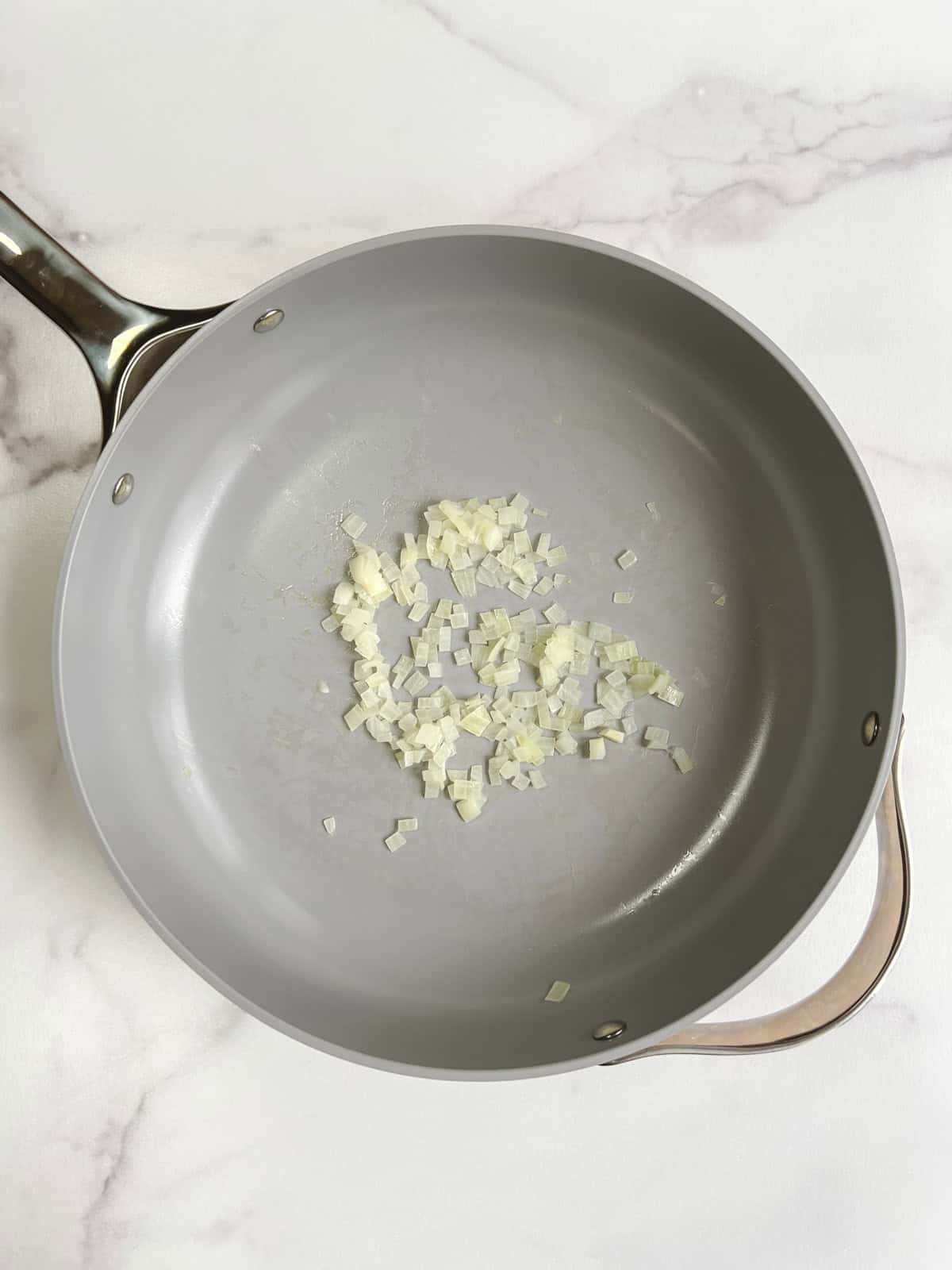 overhead view of skillet containing cooked onions