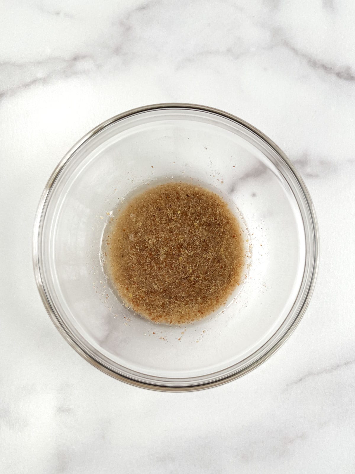 overhead view of glass bowl containing flax egg