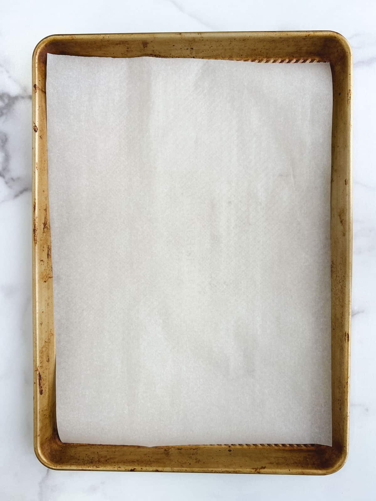 overhead view of baking sheet lined with parchment paper