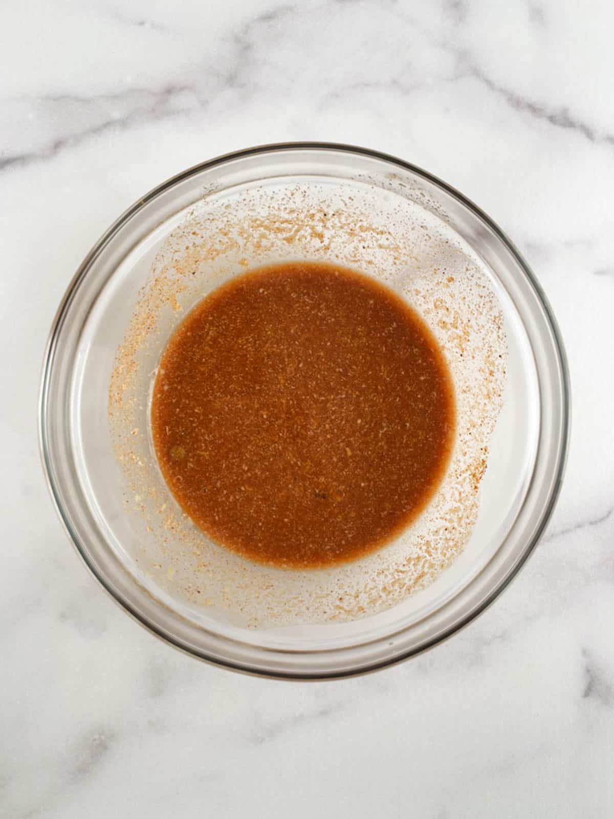 glass bowl containing blended sauce