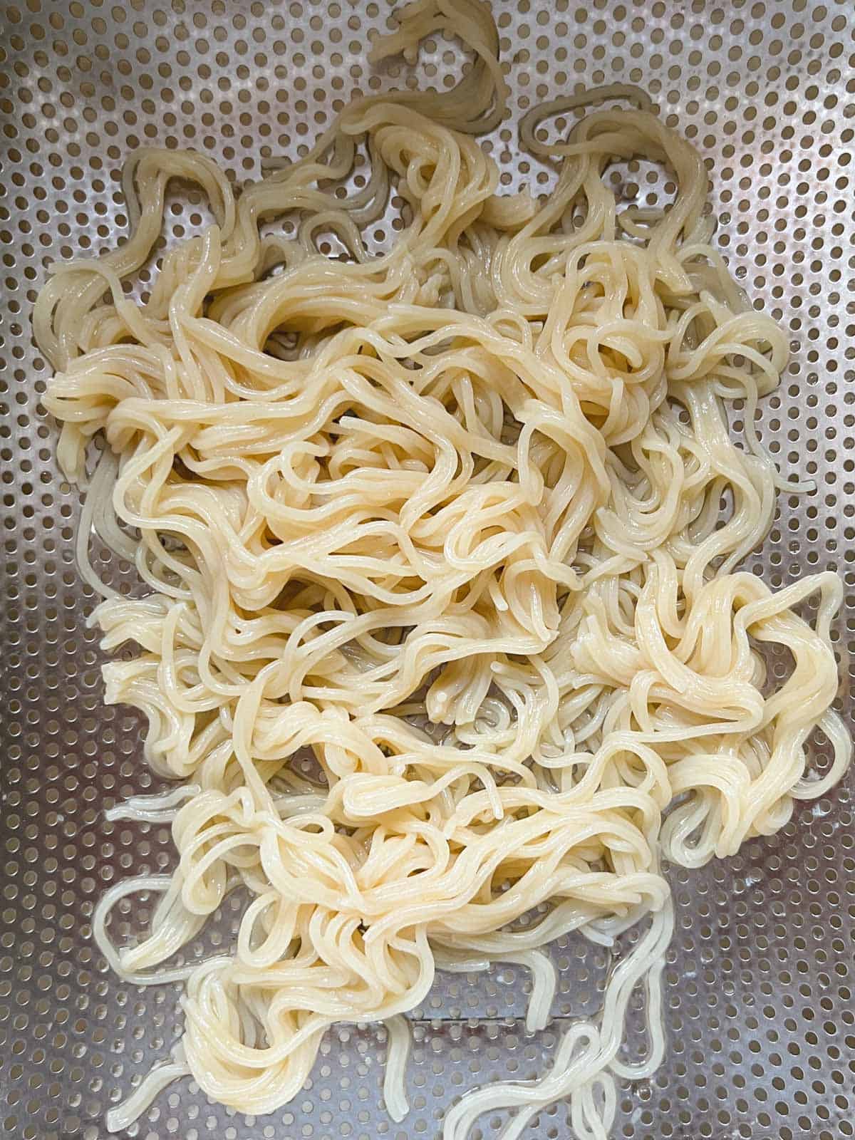 ramen noodles draining in a colander