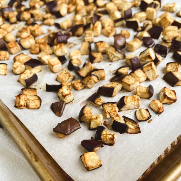 oil-free roasted eggplant on a gold baking sheet