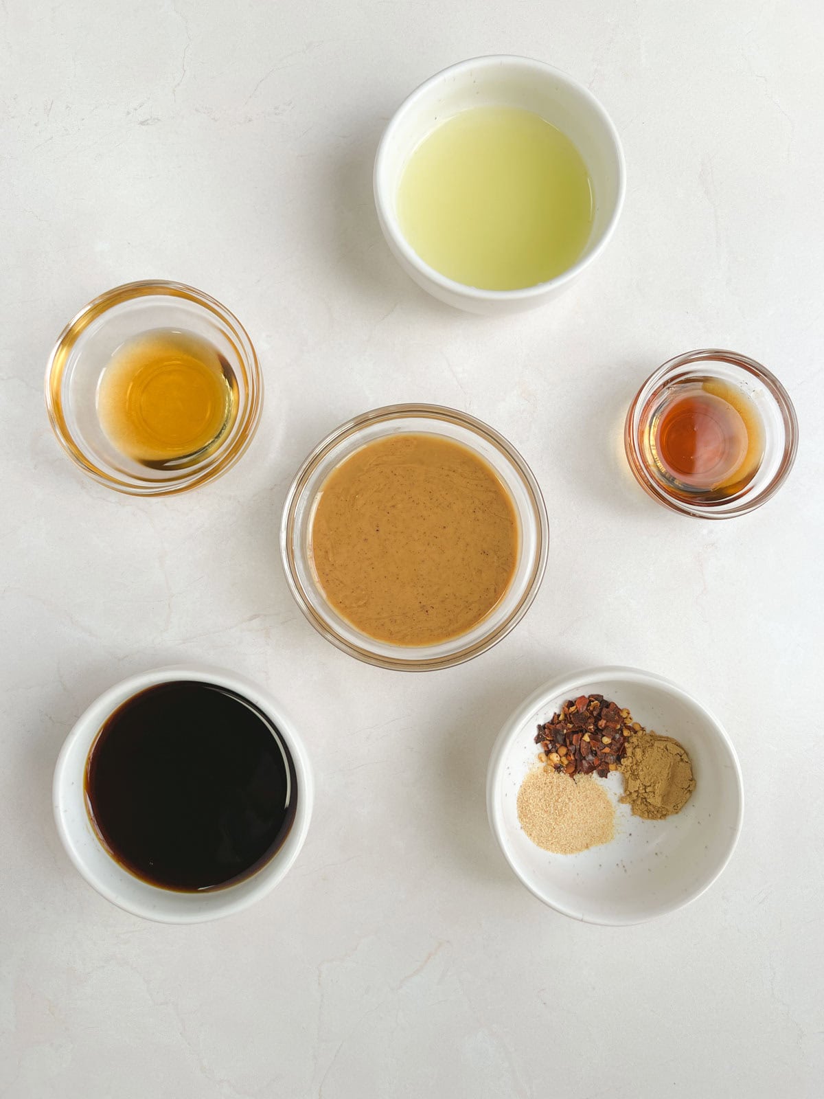 bowls of ingredients for peanut dressing