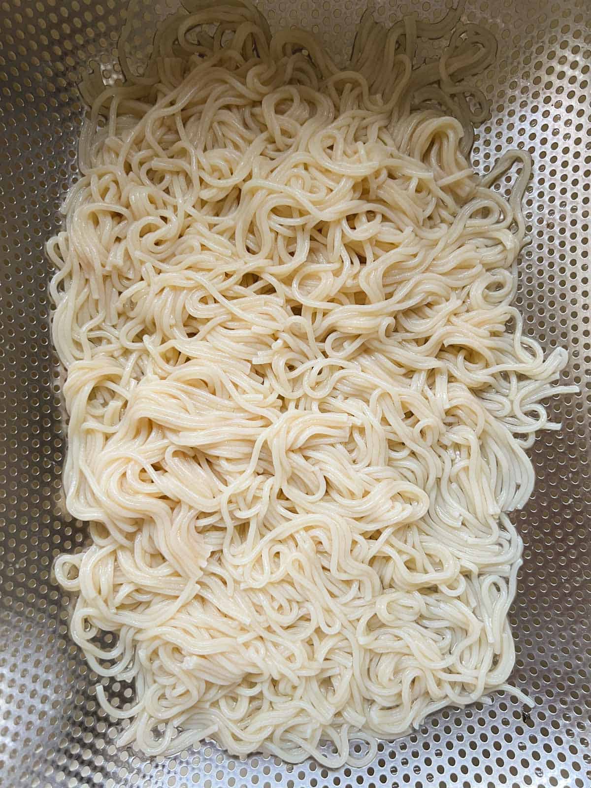 ramen noodles draining in a colander
