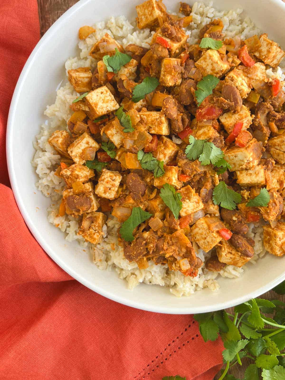 closeup of bowl of Tex-Mex skillet supper next to an orange napkin