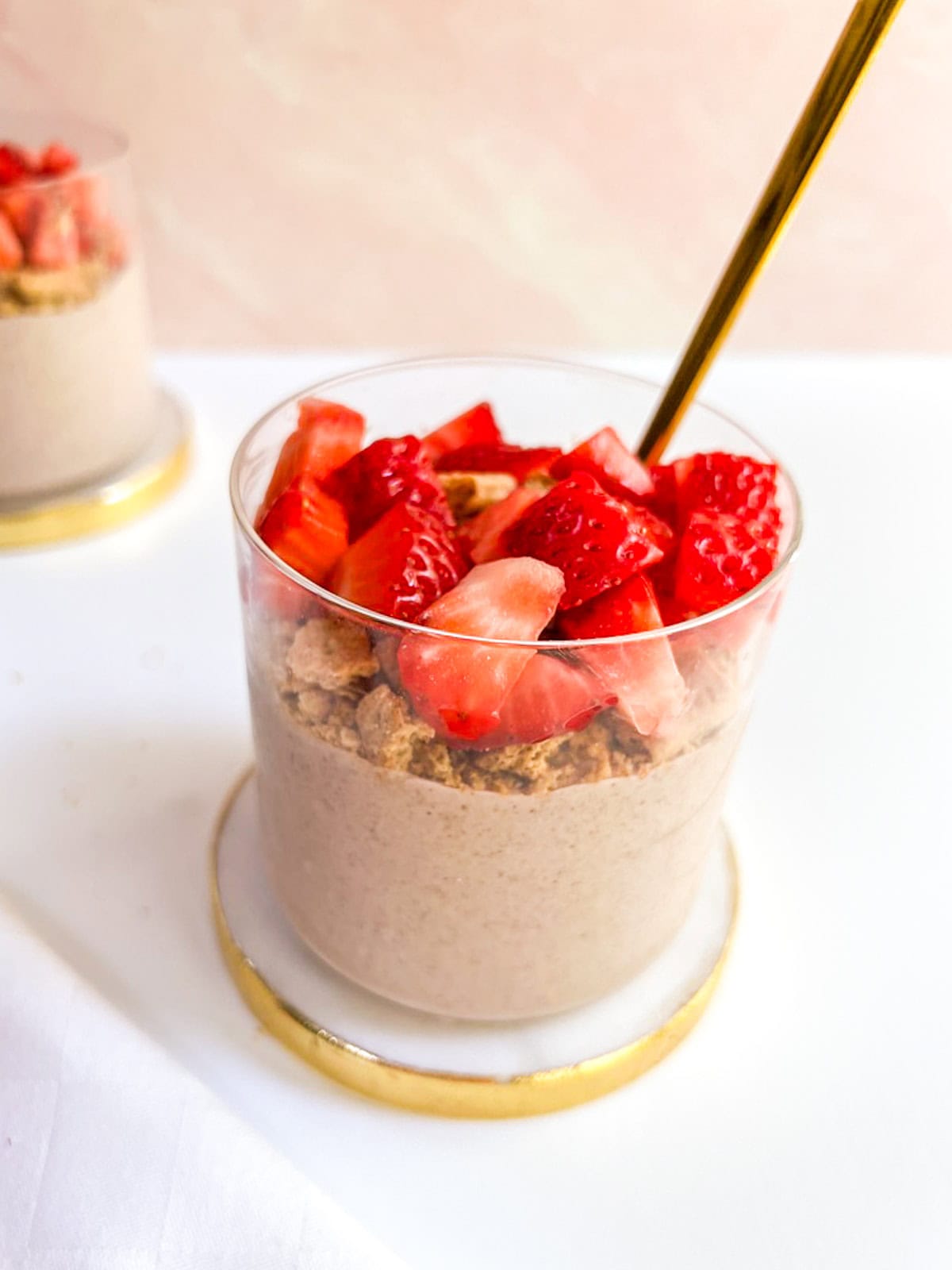 Strawberry overnight oats with crushed graham cracker and strawberry topping.