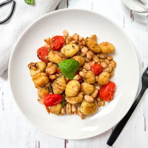 Sheet pan gnocchi with beans and tomatoes.