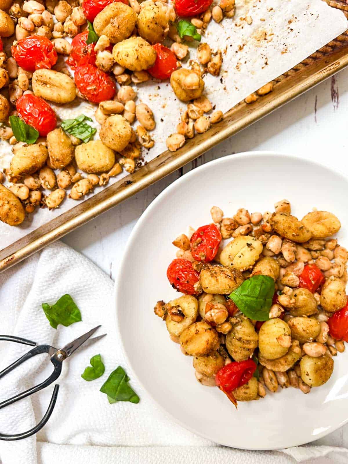 Roasted gnocchi with tomatoes and basil.