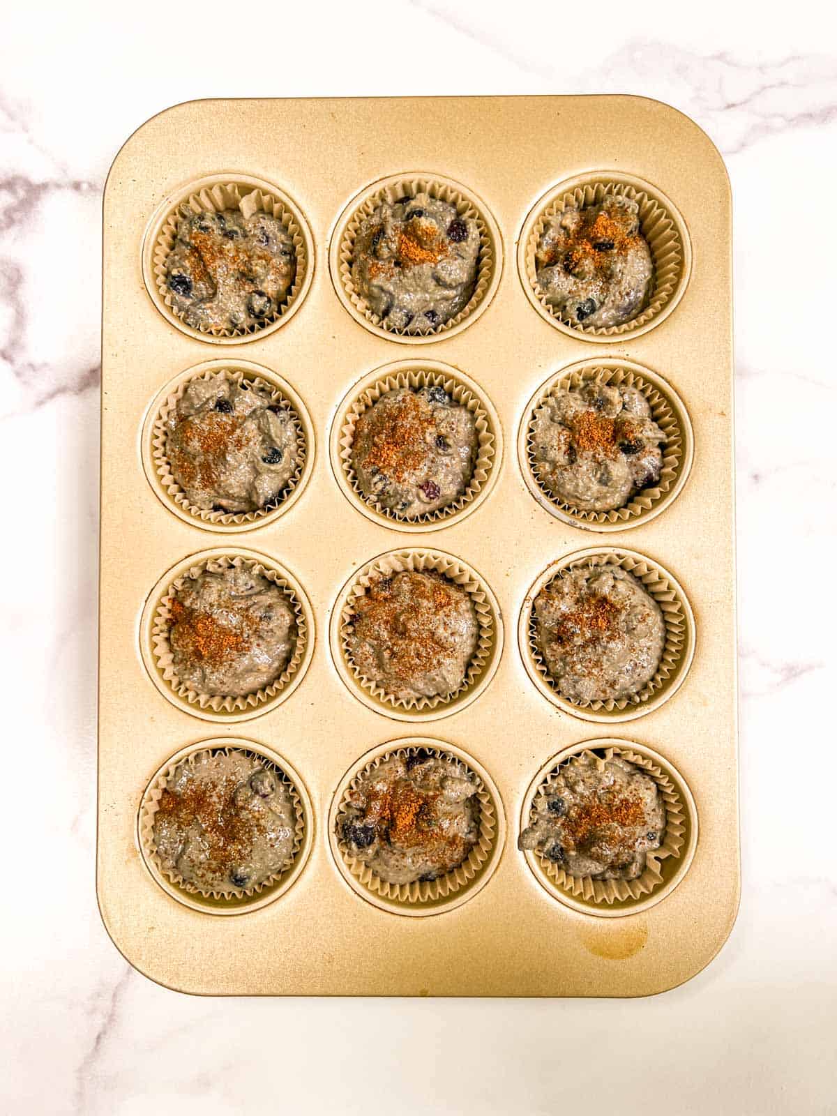 A muffin pan filled with muffins.