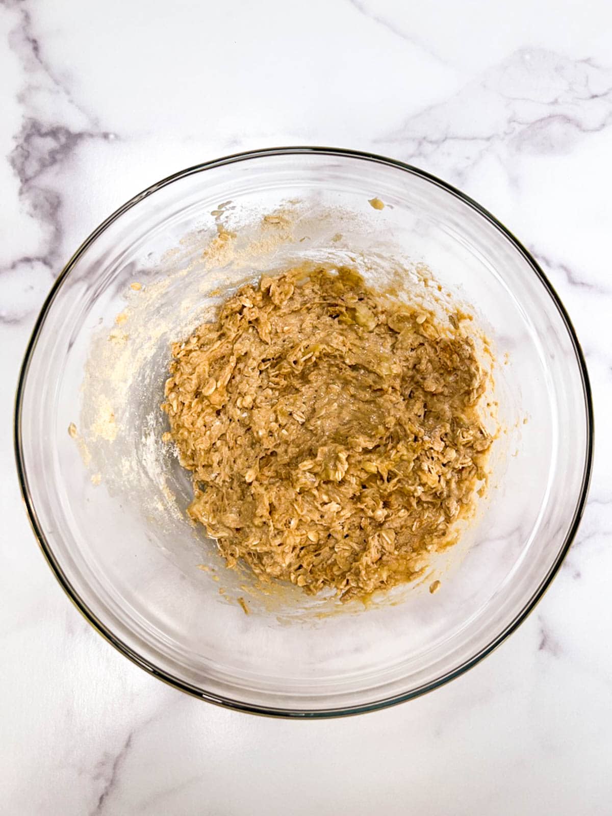 A bowl filled with oatmeal cookie dough.